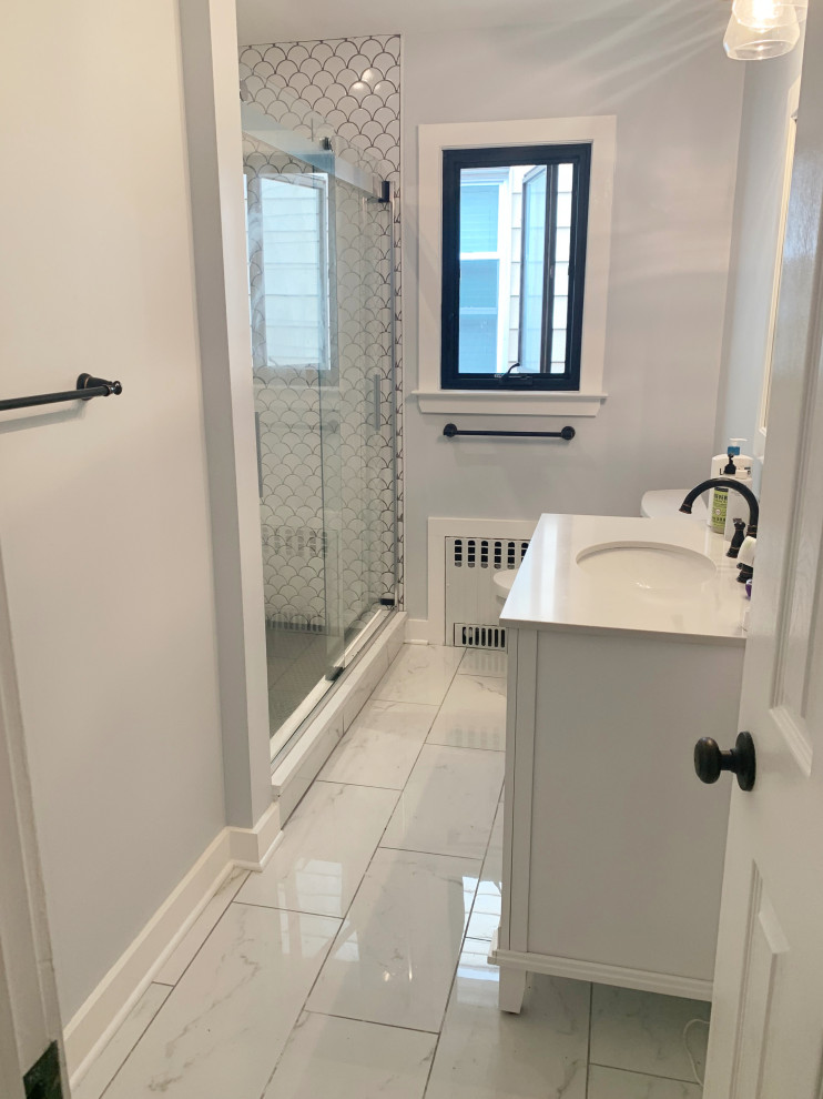 Inspiration for a small contemporary ensuite bathroom in New York with shaker cabinets, white cabinets, an alcove shower, a one-piece toilet, white tiles, ceramic tiles, grey walls, ceramic flooring, a submerged sink, quartz worktops, white floors, a sliding door, white worktops, a single sink and a freestanding vanity unit.