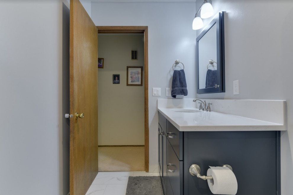 Example of a mid-sized transitional kids' white tile and subway tile porcelain tile and white floor bathroom design in Portland with shaker cabinets, blue cabinets, a one-piece toilet, gray walls, an undermount sink, quartz countertops and white countertops