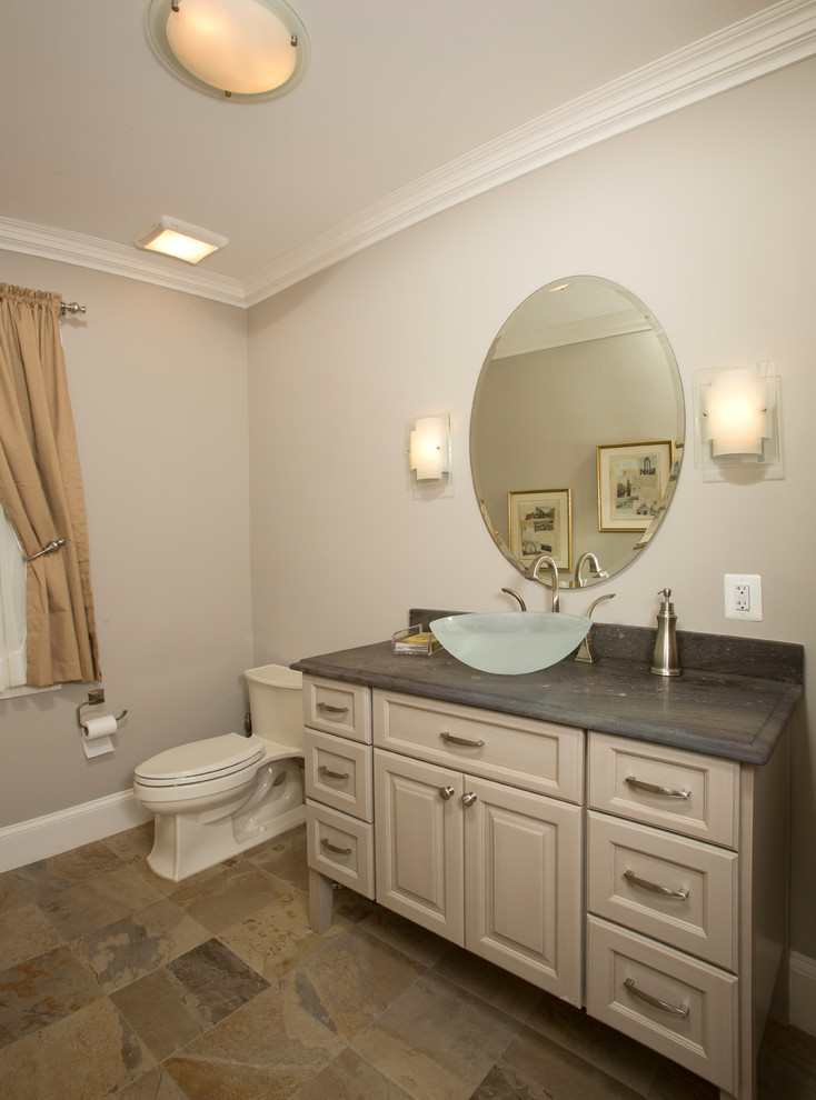 Example of a mid-sized classic master multicolored tile and stone tile ceramic tile bathroom design in DC Metro with a vessel sink, recessed-panel cabinets, beige cabinets, granite countertops, a one-piece toilet and beige walls