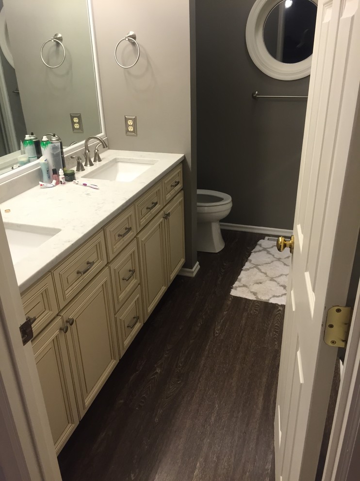 Example of a mid-sized classic master vinyl floor bathroom design in St Louis with raised-panel cabinets, white cabinets, gray walls, an undermount sink and granite countertops