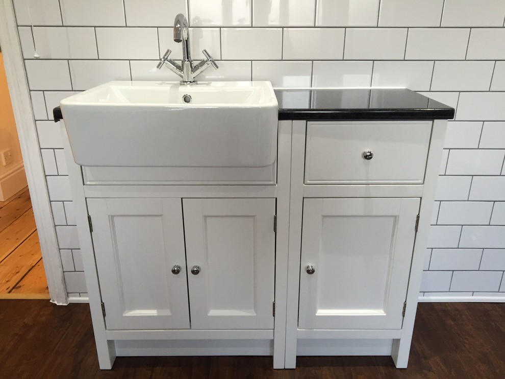 Inspiration for a large victorian family bathroom in Hampshire with white walls, vinyl flooring, a freestanding bath, a walk-in shower, a two-piece toilet, white tiles, ceramic tiles and laminate worktops.