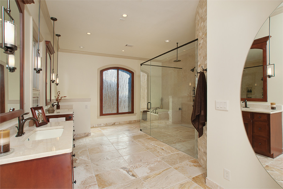 Bathroom - huge transitional master beige tile and stone tile travertine floor bathroom idea in Atlanta with an undermount sink, recessed-panel cabinets, medium tone wood cabinets, marble countertops, a two-piece toilet and beige walls