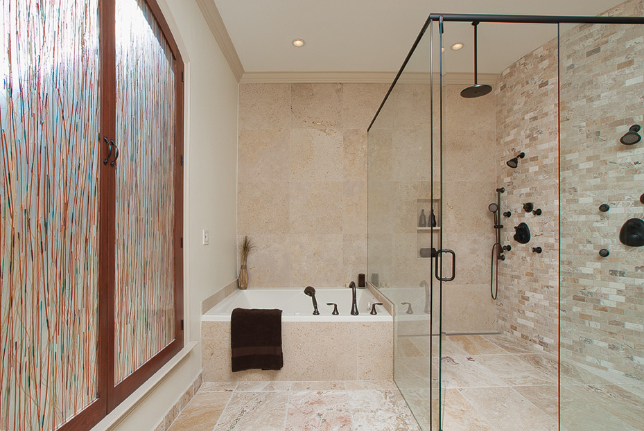 Bathroom - huge transitional master beige tile and stone tile travertine floor bathroom idea in Atlanta with an undermount sink, recessed-panel cabinets, medium tone wood cabinets, marble countertops, a two-piece toilet and beige walls