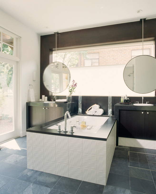 Large trendy master white tile and ceramic tile slate floor bathroom photo in Denver with a drop-in sink, flat-panel cabinets, dark wood cabinets, quartz countertops, an undermount tub, a one-piece toilet and white walls