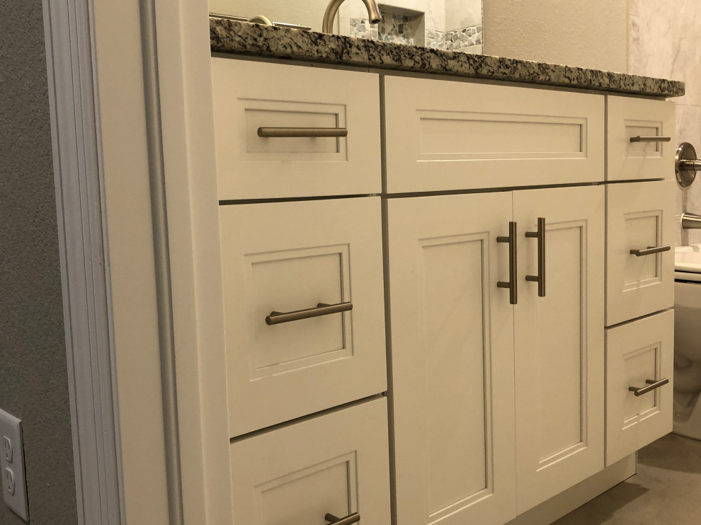 Example of a small classic master ceramic tile, beige floor and single-sink bathroom design in Other with white cabinets, a one-piece toilet, beige walls, an undermount sink, gray countertops, a freestanding vanity, shaker cabinets and granite countertops