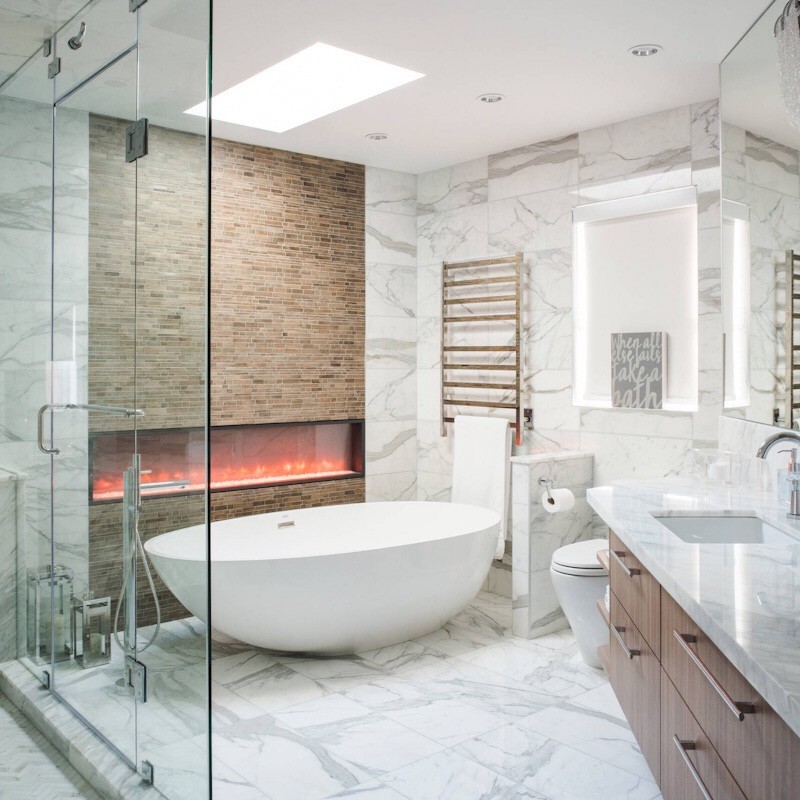 Photo of a medium sized contemporary ensuite bathroom in Toronto with shaker cabinets, white cabinets, a claw-foot bath, a built-in shower, a one-piece toilet, white tiles, porcelain tiles, grey walls, porcelain flooring, a submerged sink, engineered stone worktops, white floors, a sliding door and grey worktops.
