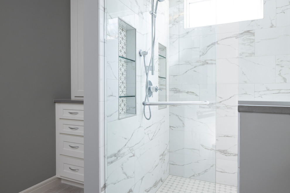 Inspiration for a large contemporary master white tile and marble tile porcelain tile and gray floor alcove shower remodel in Kansas City with shaker cabinets, white cabinets, gray walls, an undermount sink, quartzite countertops, a hinged shower door and gray countertops