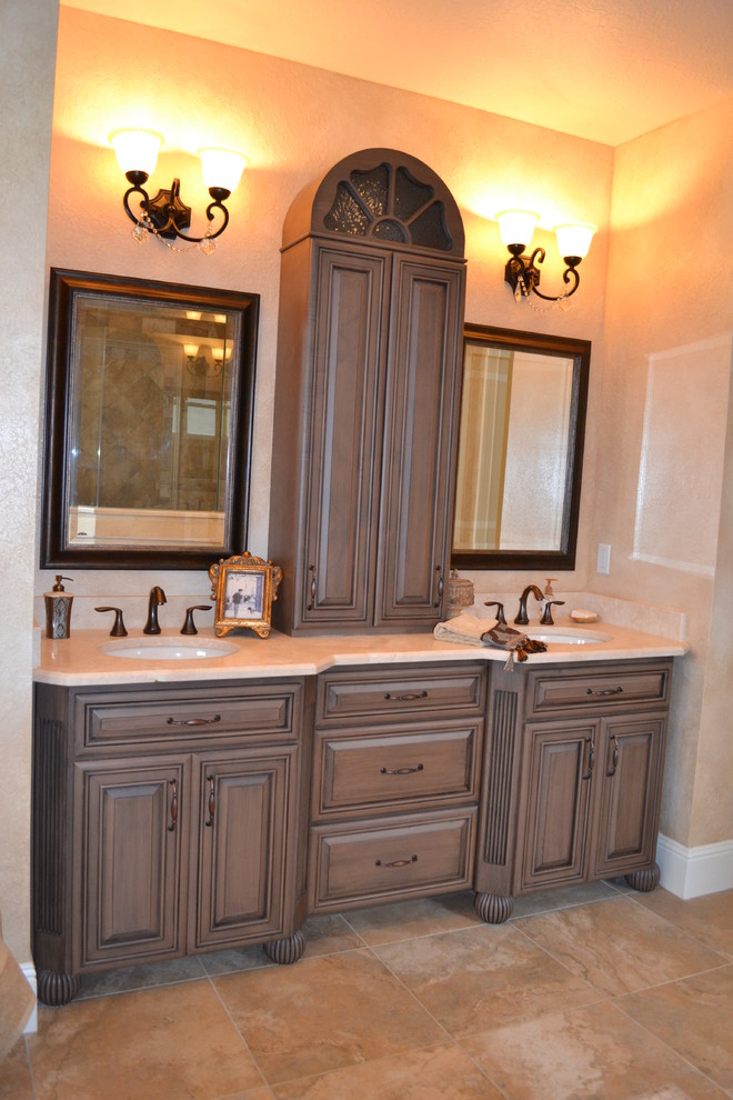 Photo of a large classic ensuite bathroom in Orlando with raised-panel cabinets, grey cabinets and a submerged sink.