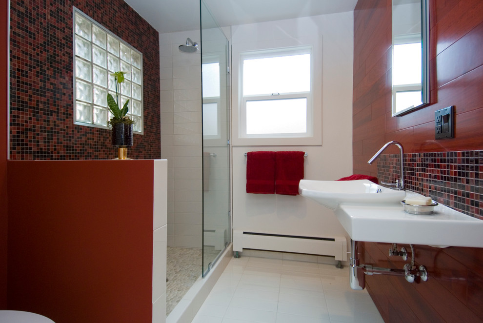 This is an example of a contemporary ensuite bathroom in San Francisco with a walk-in shower, orange tiles, porcelain tiles, white walls, ceramic flooring, a wall-mounted sink and solid surface worktops.