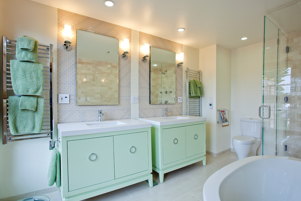 Inspiration for a contemporary ensuite bathroom in San Francisco with flat-panel cabinets, green cabinets, a freestanding bath, a walk-in shower, a two-piece toilet, white tiles, porcelain tiles, white walls, ceramic flooring, a submerged sink and solid surface worktops.