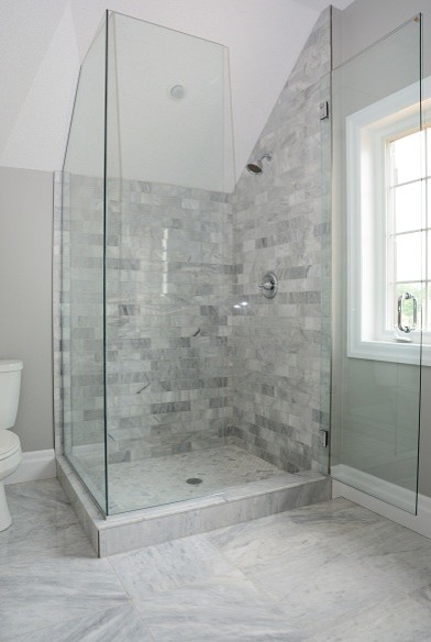 Inspiration for a transitional master gray tile and stone tile marble floor corner shower remodel in Toronto with gray walls