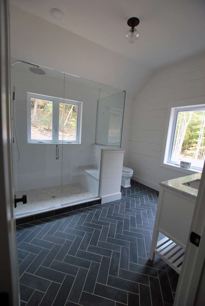Example of a mid-sized mid-century modern master white tile and ceramic tile ceramic tile doorless shower design in New York with shaker cabinets, white cabinets, a two-piece toilet, white walls, a drop-in sink and quartz countertops