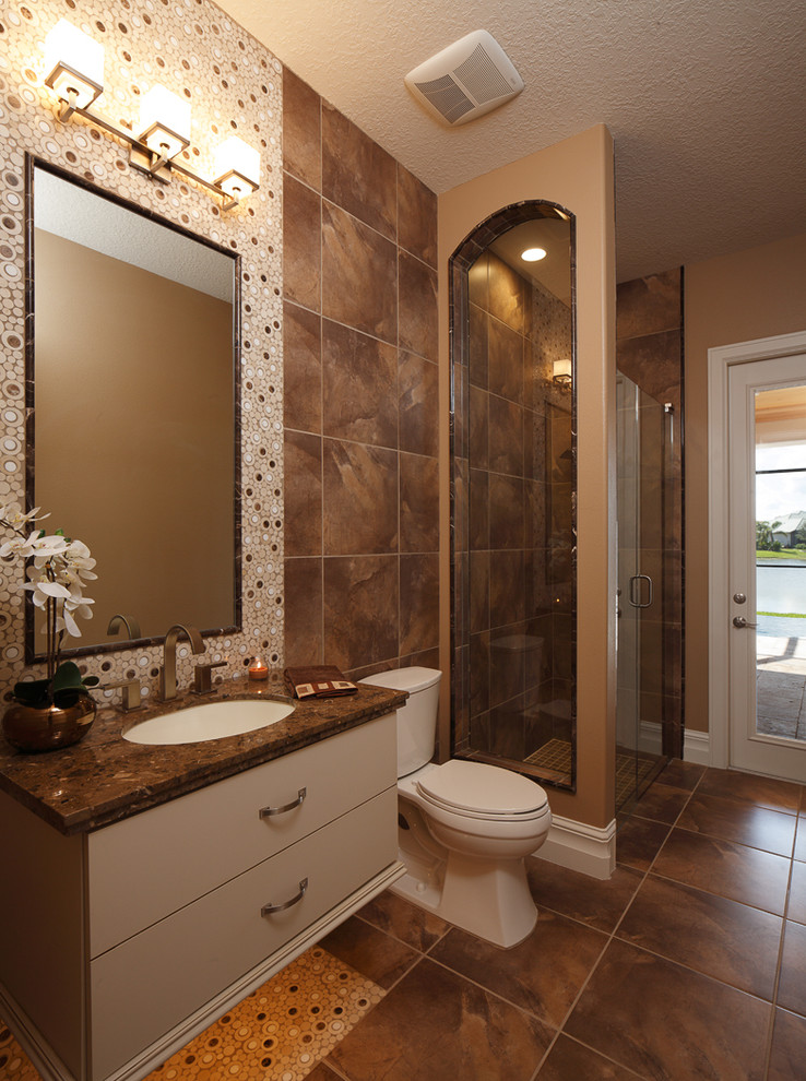 Transitional beige tile and ceramic tile porcelain tile and beige floor bathroom photo in Orlando with raised-panel cabinets, medium tone wood cabinets, beige walls, a vessel sink and soapstone countertops