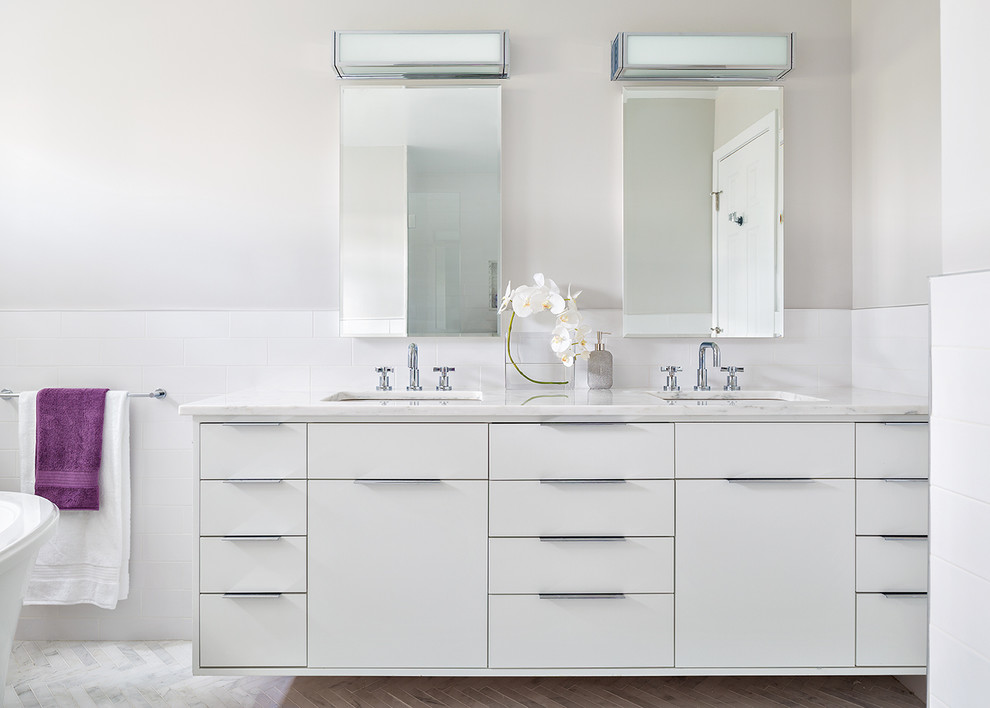 Contemporary ensuite bathroom in New York with a submerged sink, flat-panel cabinets, white cabinets, white tiles, metro tiles and grey walls.