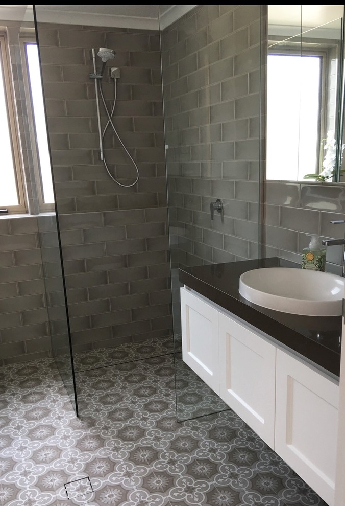 Design ideas for a small classic bathroom in Wollongong with shaker cabinets, white cabinets, a walk-in shower, a one-piece toilet, beige tiles, ceramic tiles, beige walls, cement flooring, a built-in sink, engineered stone worktops, beige floors, an open shower and brown worktops.