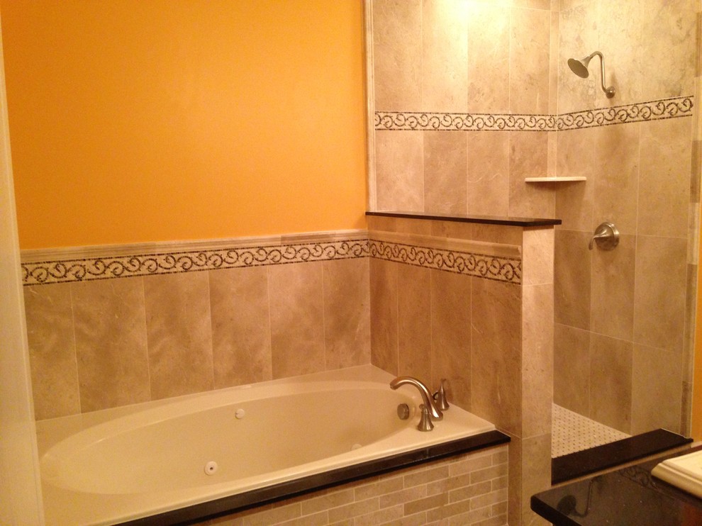 На фото: ванная комната в классическом стиле с столешницей из гранита, накладной ванной, угловым душем, бежевой плиткой и каменной плиткой