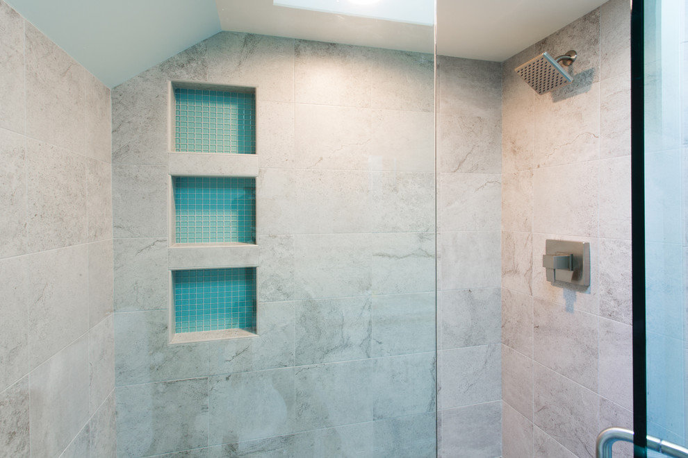 This is an example of a contemporary bathroom in Portland with an alcove shower, beige tiles, blue tiles, porcelain tiles and a hinged door.