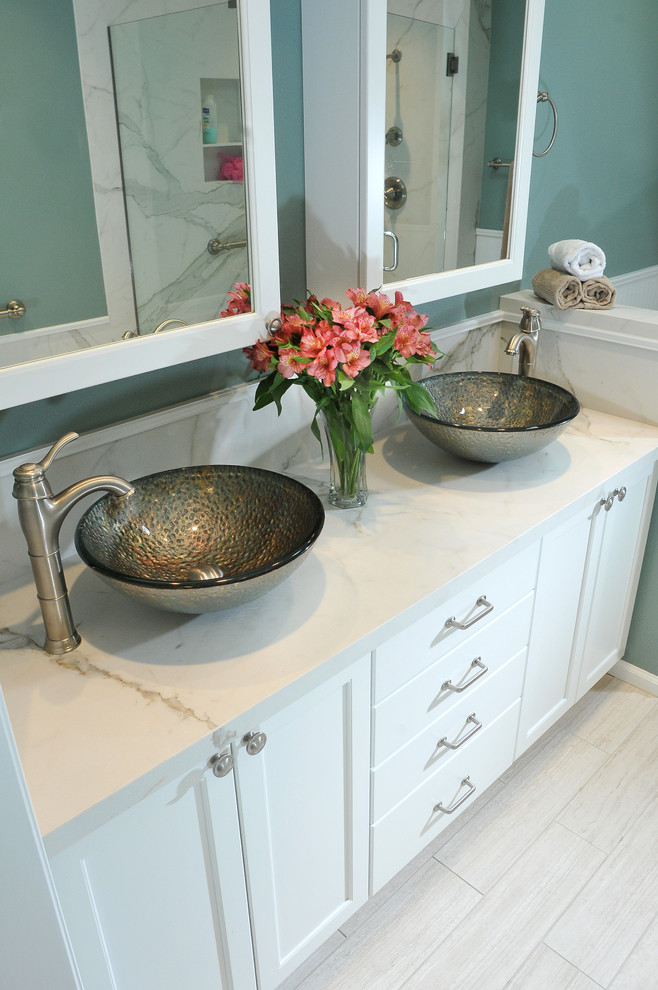 Inspiration for a mid-sized transitional white tile and porcelain tile porcelain tile bathroom remodel in Denver with a vessel sink, shaker cabinets, white cabinets and blue walls