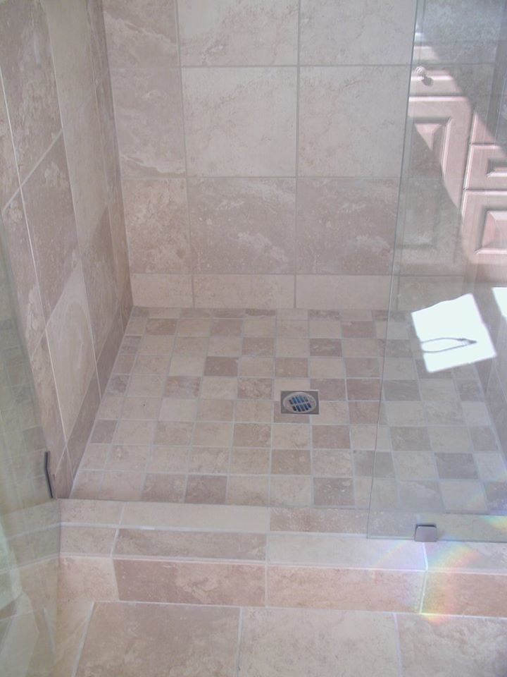 This is an example of a medium sized traditional ensuite bathroom in Other with recessed-panel cabinets, dark wood cabinets, an alcove bath, an alcove shower, a two-piece toilet, beige tiles, ceramic tiles, grey walls, ceramic flooring, a submerged sink, tiled worktops, beige floors and a hinged door.