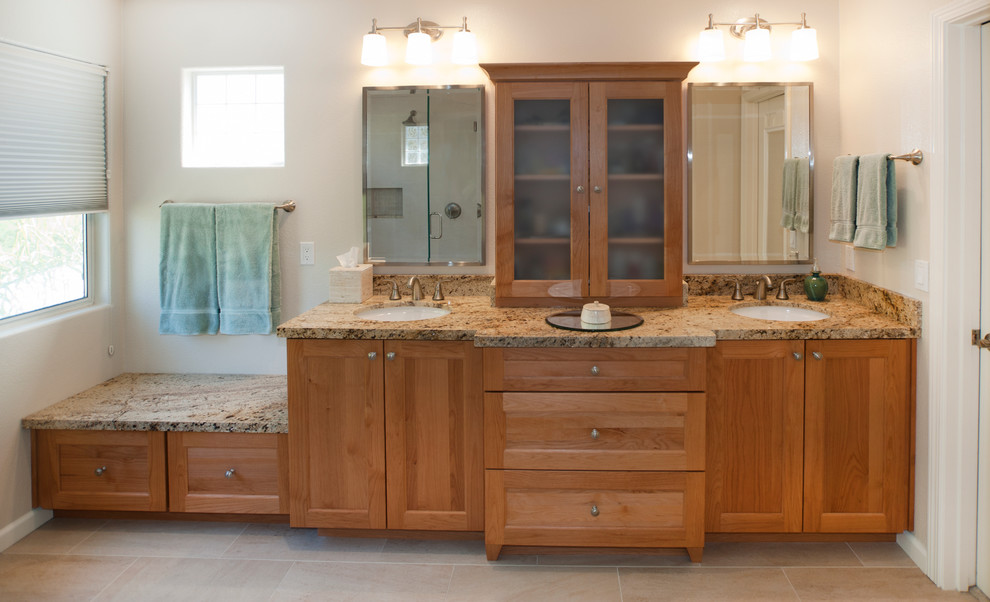 This is an example of a large traditional ensuite bathroom in San Francisco with recessed-panel cabinets, light wood cabinets, beige walls, ceramic flooring, a submerged sink and granite worktops.