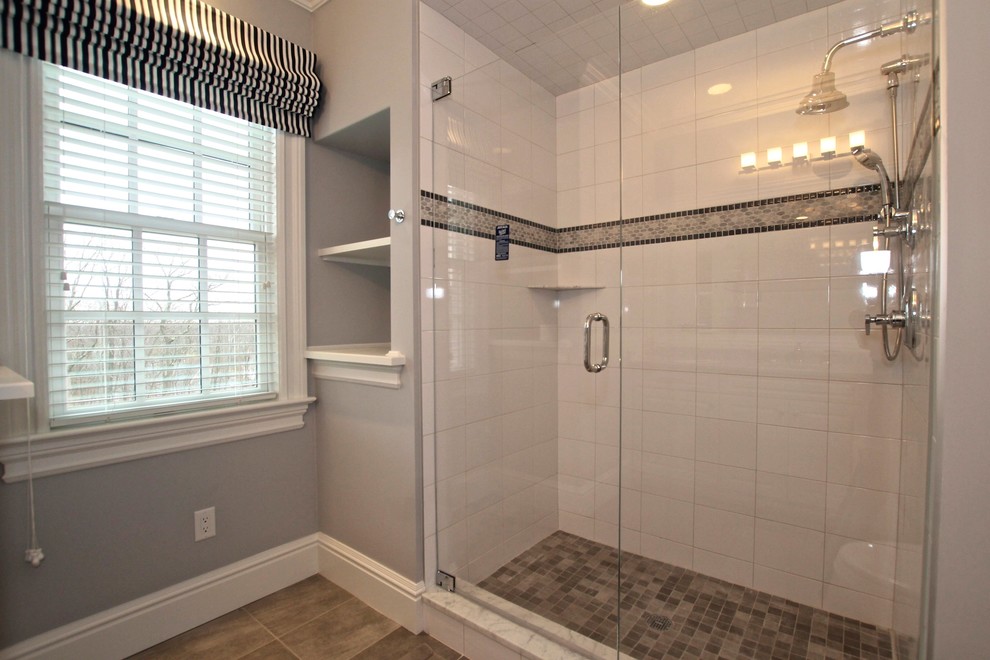 Walk-in shower - mid-sized traditional kids' white tile and ceramic tile porcelain tile walk-in shower idea in Bridgeport with gray walls and white cabinets
