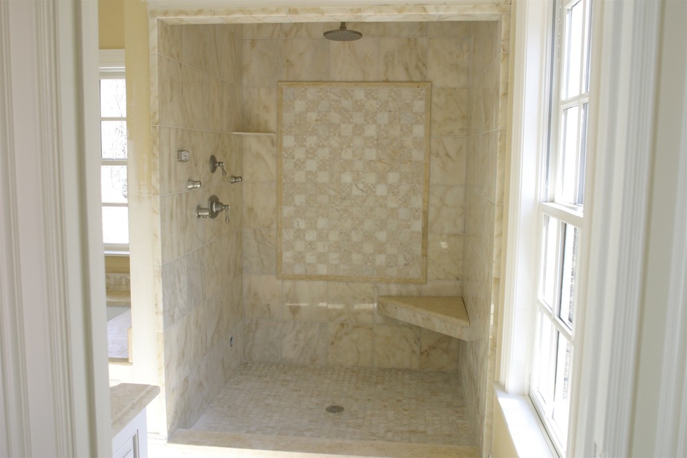 Example of a huge classic master beige tile, white tile and stone tile marble floor alcove shower design in Bridgeport with furniture-like cabinets, white cabinets, an undermount tub, yellow walls and an undermount sink