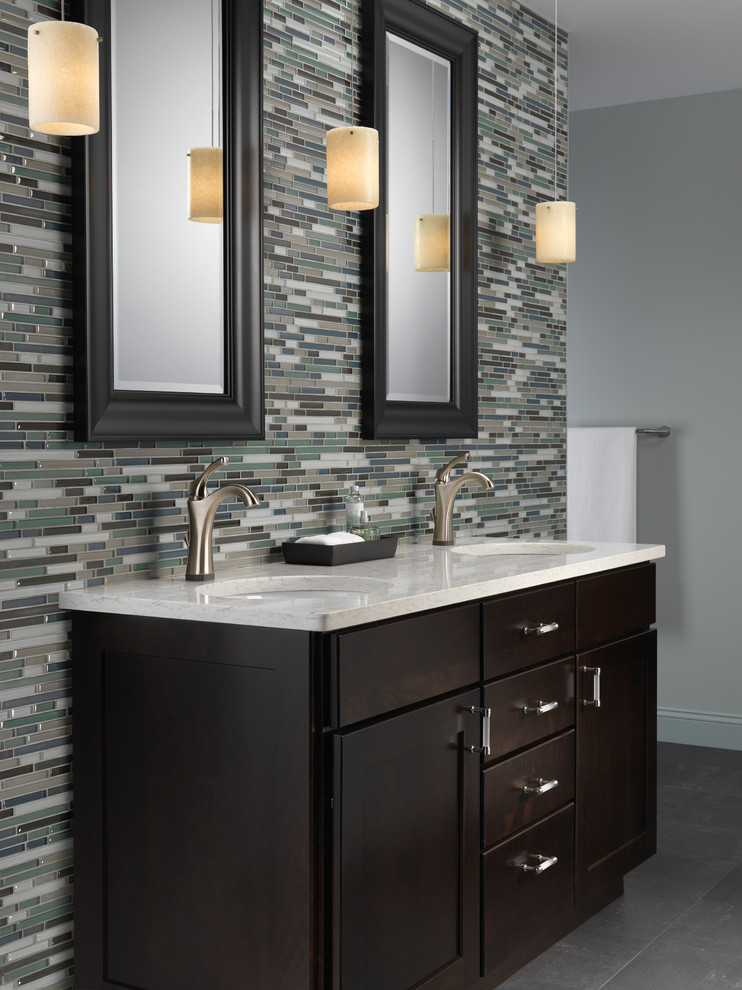 Photo of a modern bathroom in Indianapolis with a submerged sink, flat-panel cabinets, dark wood cabinets, green tiles, matchstick tiles and green walls.