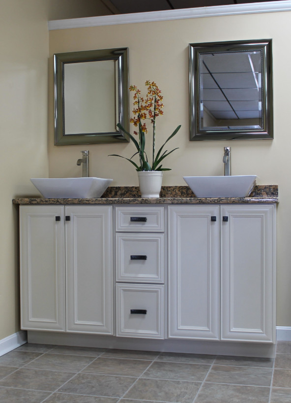 Inspiration for a mid-sized timeless master ceramic tile bathroom remodel in Providence with recessed-panel cabinets, white cabinets, beige walls, a vessel sink and granite countertops
