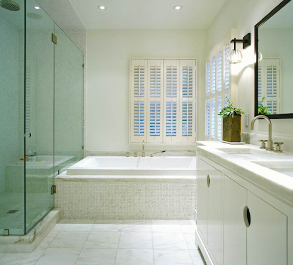 Inspiration for a mid-sized contemporary master white tile bathroom remodel in New York with flat-panel cabinets, white cabinets and white walls