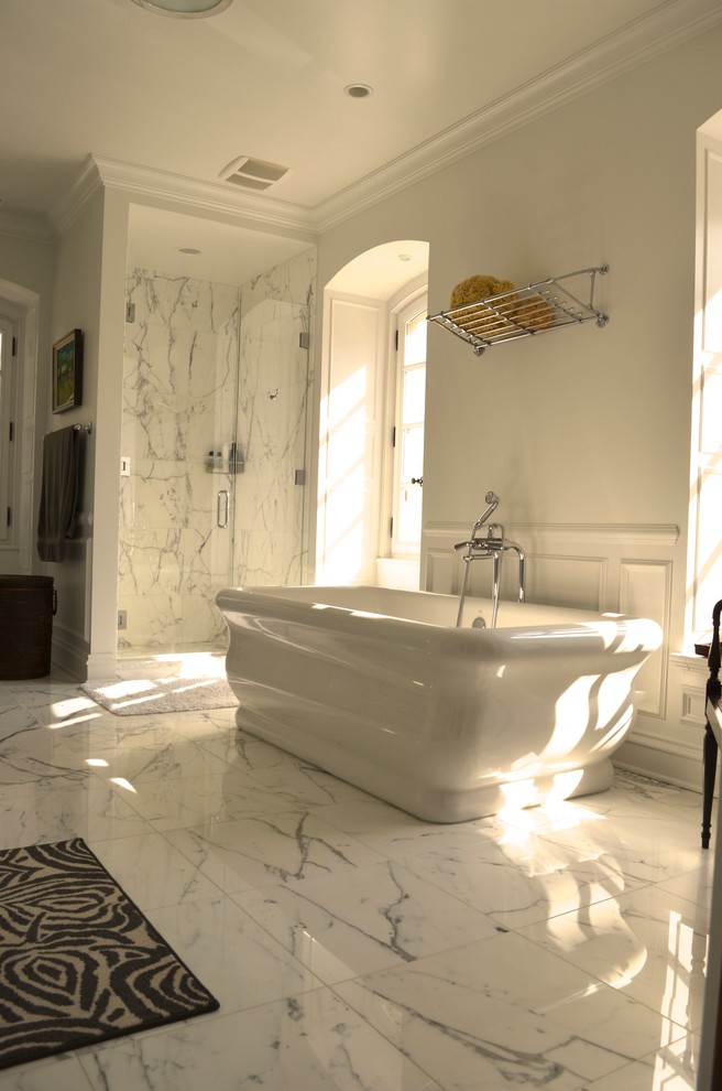 Inspiration for a large traditional ensuite bathroom in Chicago with shaker cabinets, white cabinets, a freestanding bath, a corner shower, a one-piece toilet, white tiles, stone slabs, white walls, marble flooring, an integrated sink and marble worktops.