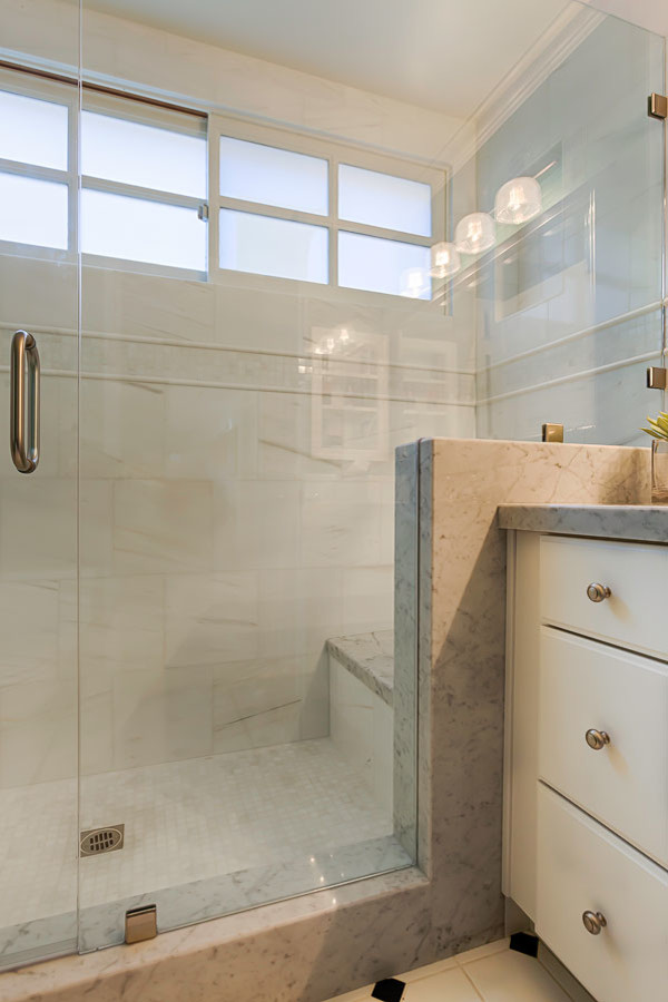 Inspiration for a small traditional family bathroom in Los Angeles with a submerged sink, raised-panel cabinets, marble worktops, a walk-in shower, a two-piece toilet, white tiles, mosaic tiles, green walls and porcelain flooring.