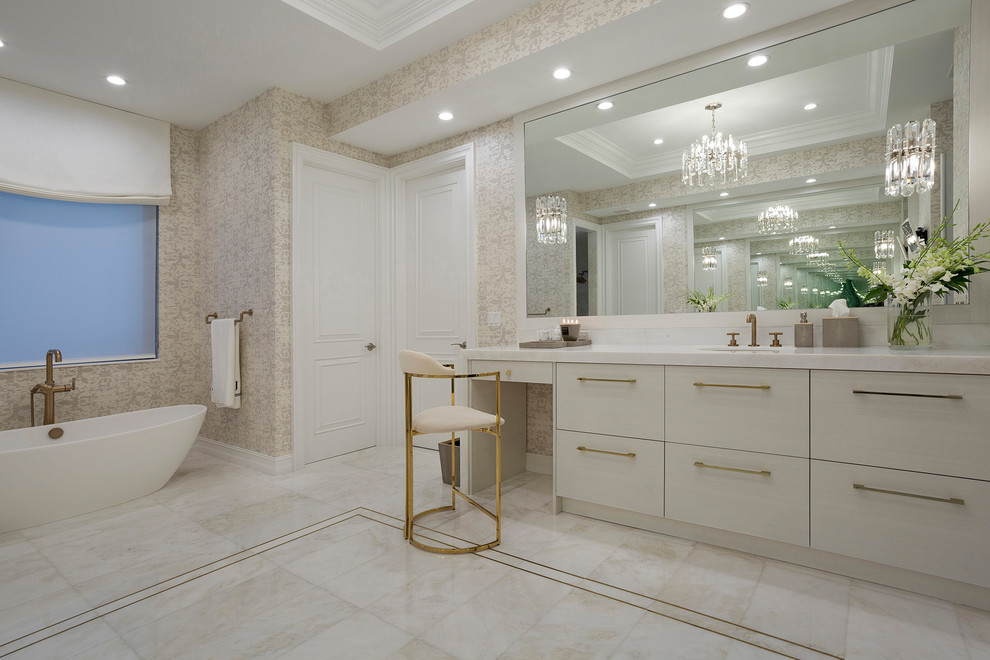На фото: огромная главная ванная комната в современном стиле с плоскими фасадами, белыми фасадами, отдельно стоящей ванной, унитазом-моноблоком, мраморным полом, врезной раковиной, мраморной столешницей, белым полом и душем с распашными дверями