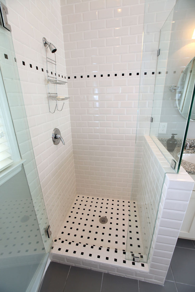 Example of a transitional white tile and subway tile corner shower design in Atlanta