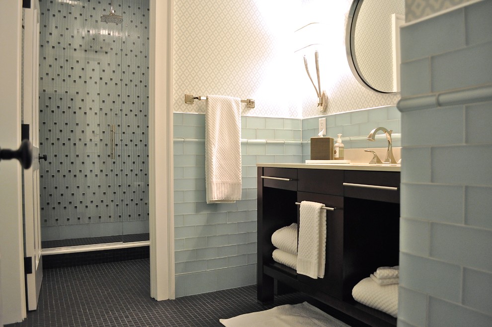Mid-sized transitional master blue tile and glass tile mosaic tile floor alcove shower photo in Other with an integrated sink, furniture-like cabinets, dark wood cabinets, quartz countertops and white walls