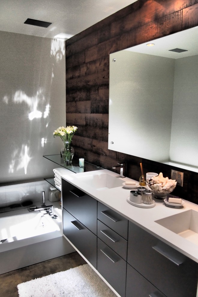 Inspiration for a medium sized modern ensuite bathroom in Los Angeles with flat-panel cabinets, grey cabinets, a corner shower, a one-piece toilet, grey tiles, porcelain tiles, brown walls, porcelain flooring, a submerged sink and quartz worktops.