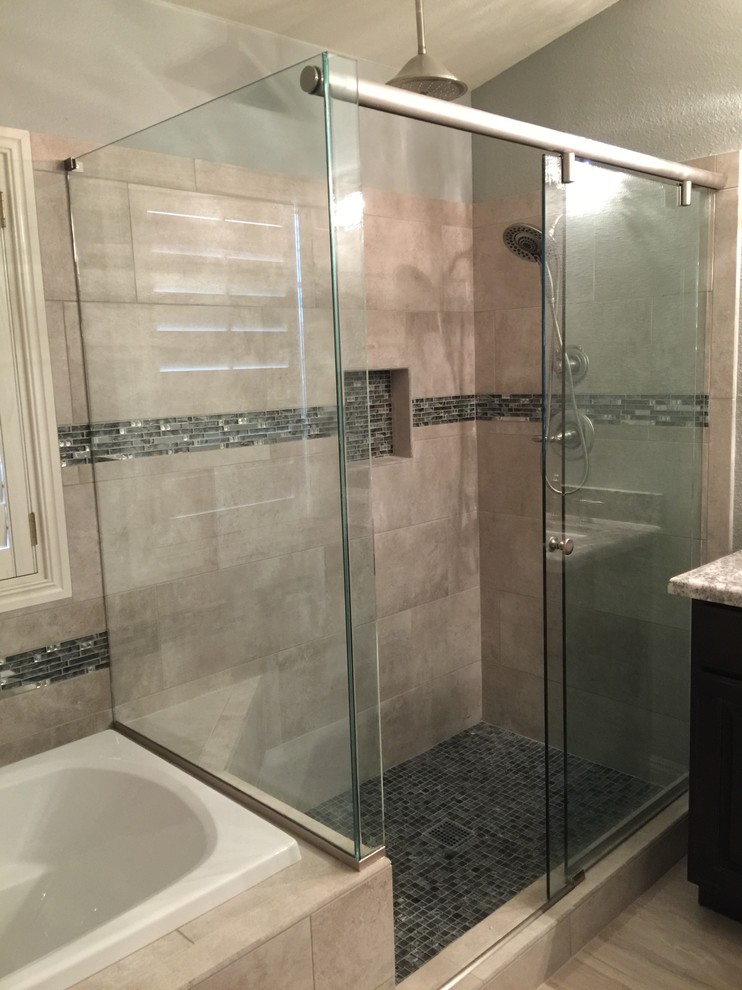 Large elegant gray tile and porcelain tile porcelain tile bathroom photo in Las Vegas with flat-panel cabinets, black cabinets, gray walls, an undermount sink and granite countertops