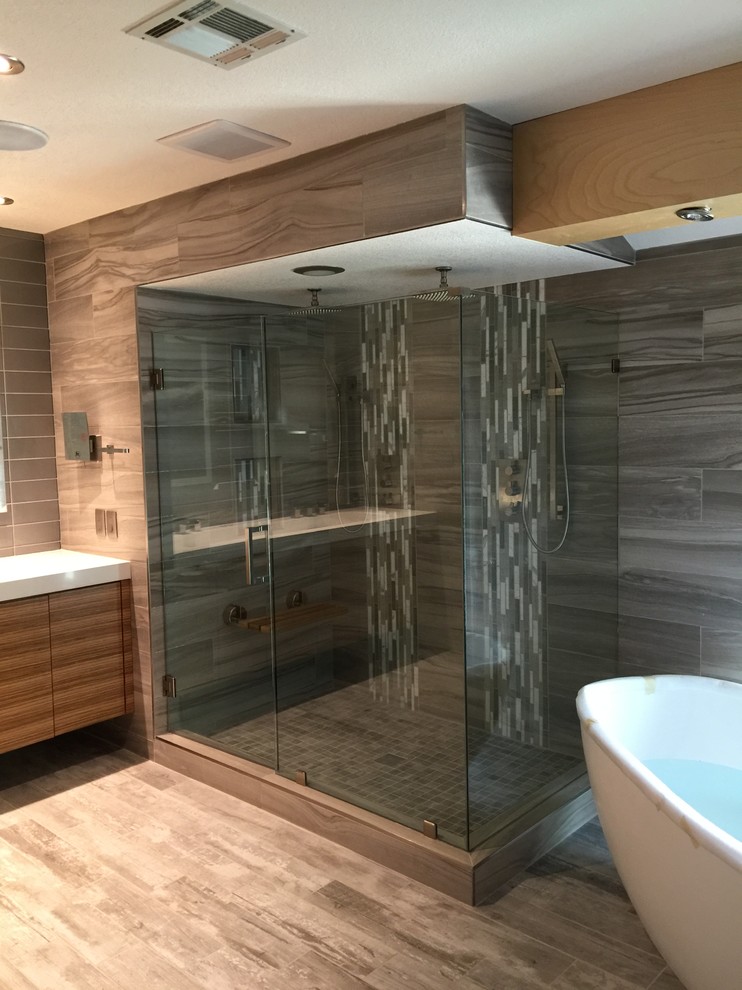 Large elegant bathroom photo in Las Vegas with flat-panel cabinets, dark wood cabinets, beige walls and an integrated sink