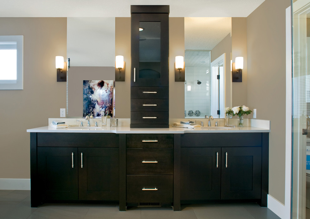 Photo of a contemporary bathroom in Other with shaker cabinets and dark wood cabinets.