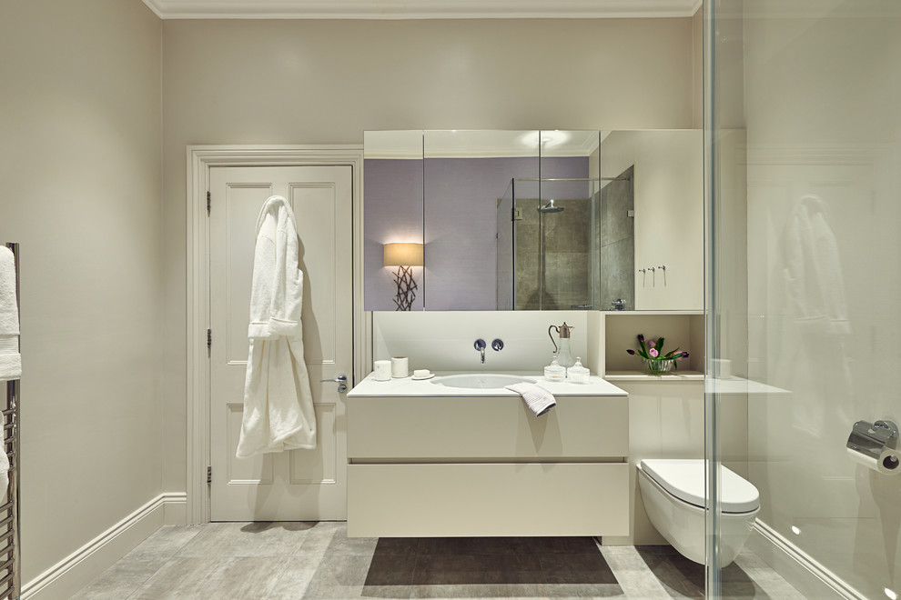 This is an example of a contemporary bathroom in London with feature lighting.