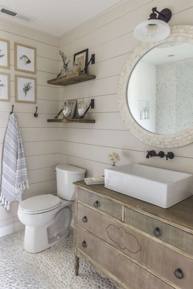 Inspiration for a mid-sized transitional 3/4 gray floor, single-sink and shiplap wall bathroom remodel in Austin with medium tone wood cabinets, a two-piece toilet, gray walls, a vessel sink, wood countertops, brown countertops, a freestanding vanity and flat-panel cabinets