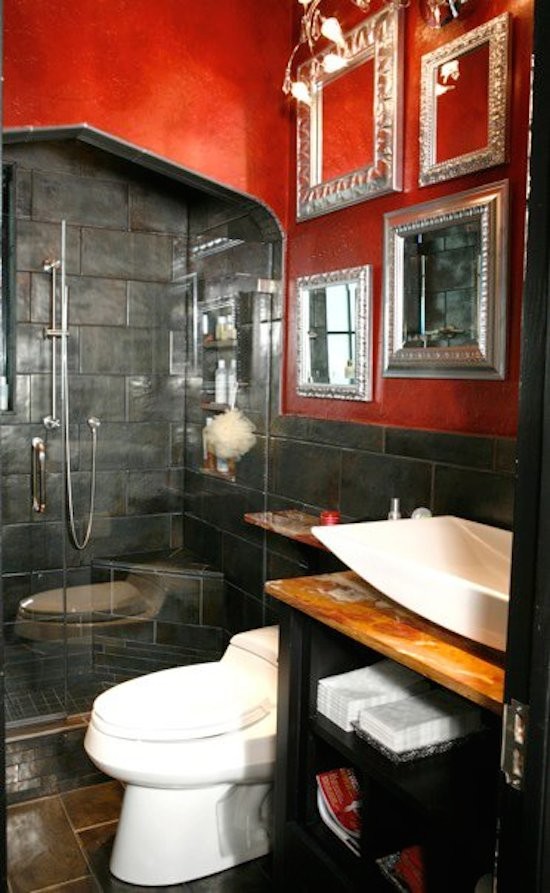 Large ornate master gray tile and stone tile ceramic tile and multicolored floor alcove shower photo in Atlanta with open cabinets, black cabinets, a one-piece toilet, red walls, a vessel sink, laminate countertops and a hinged shower door