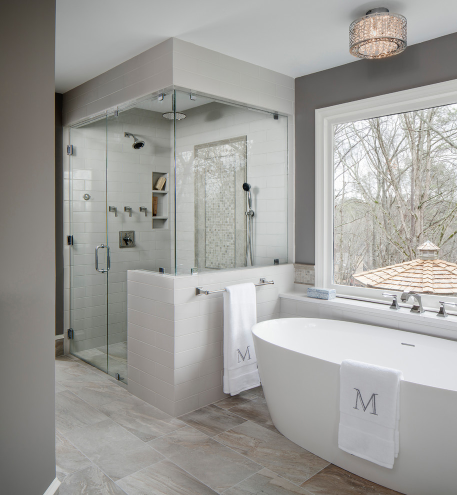 Inspiration for a large transitional master gray tile and ceramic tile porcelain tile and gray floor bathroom remodel in Atlanta with gray walls, a hinged shower door, flat-panel cabinets, gray cabinets, a two-piece toilet, an undermount sink and quartz countertops