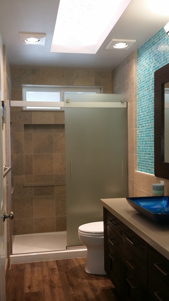 Small trendy master beige tile linoleum floor alcove shower photo in San Luis Obispo with a vessel sink, flat-panel cabinets, distressed cabinets, quartz countertops, a one-piece toilet and blue walls