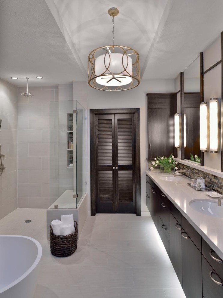 Bathroom - large contemporary master ceramic tile porcelain tile and gray floor bathroom idea in Los Angeles with flat-panel cabinets, black cabinets, gray walls, an undermount sink, quartz countertops and white countertops