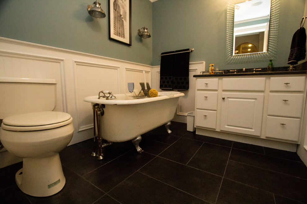 Mid-sized trendy 3/4 black tile and ceramic tile slate floor claw-foot bathtub photo in DC Metro with a drop-in sink, flat-panel cabinets, white cabinets, granite countertops and blue walls