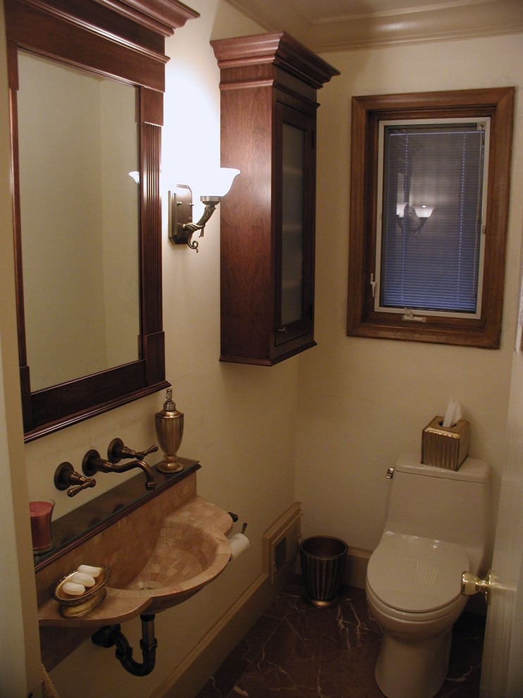 Elegant powder room photo in Detroit with a wall-mount sink, raised-panel cabinets, dark wood cabinets and a one-piece toilet