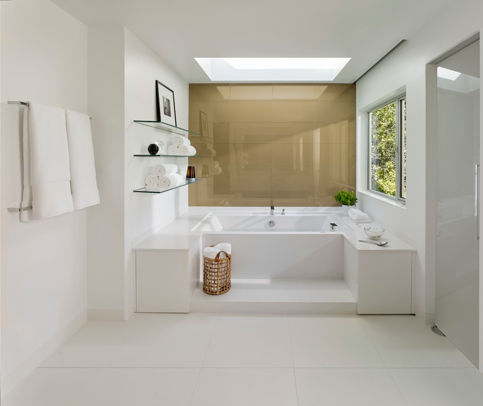 This is an example of a large contemporary ensuite bathroom in San Francisco with an alcove bath, white tiles, stone slabs, white walls, porcelain flooring, flat-panel cabinets, white cabinets and solid surface worktops.
