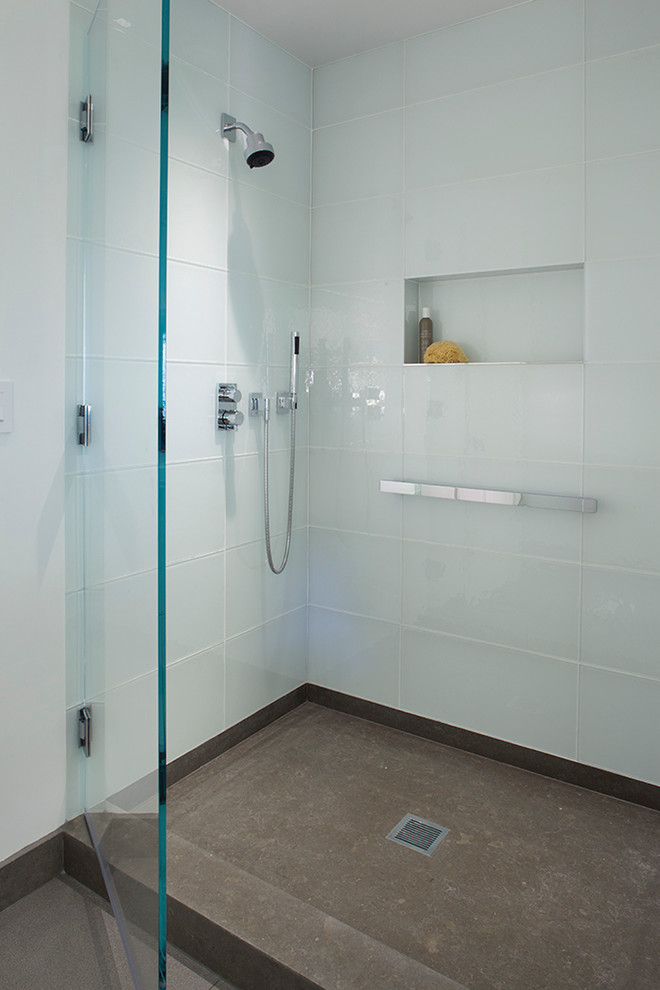 Design ideas for a medium sized classic shower room bathroom in San Francisco with flat-panel cabinets, black cabinets, a corner shower, blue tiles, glass tiles, blue walls, ceramic flooring, an integrated sink and solid surface worktops.