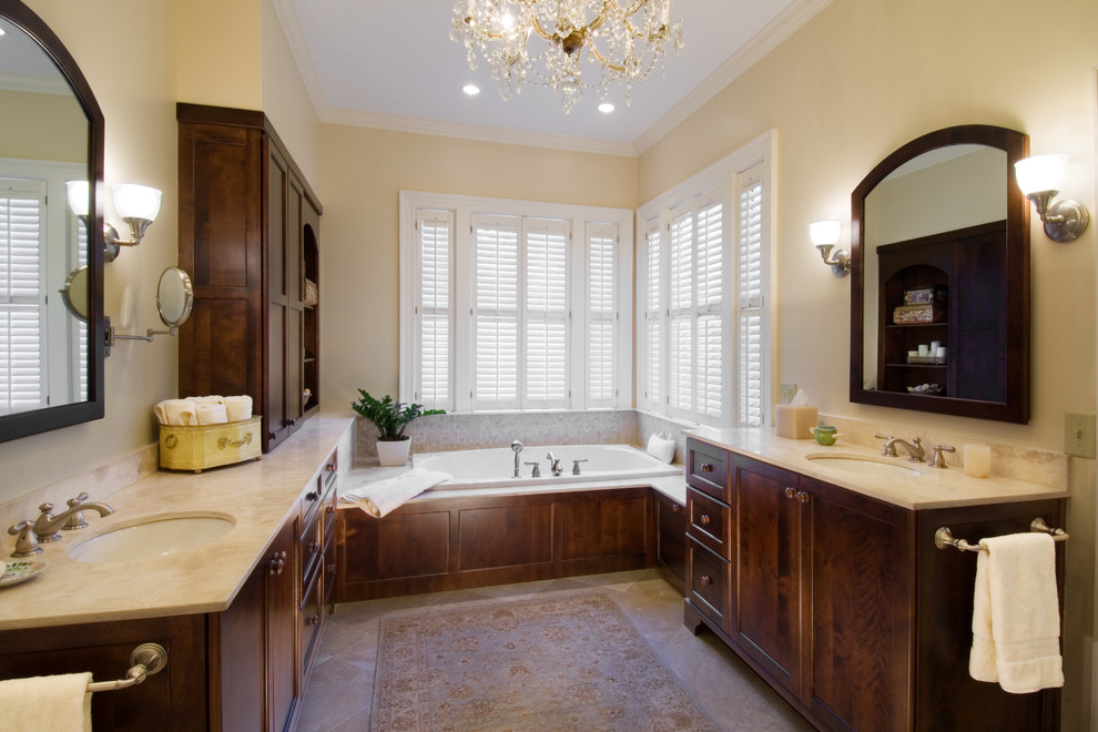 This is an example of a traditional bathroom in Atlanta with a built-in bath and feature lighting.
