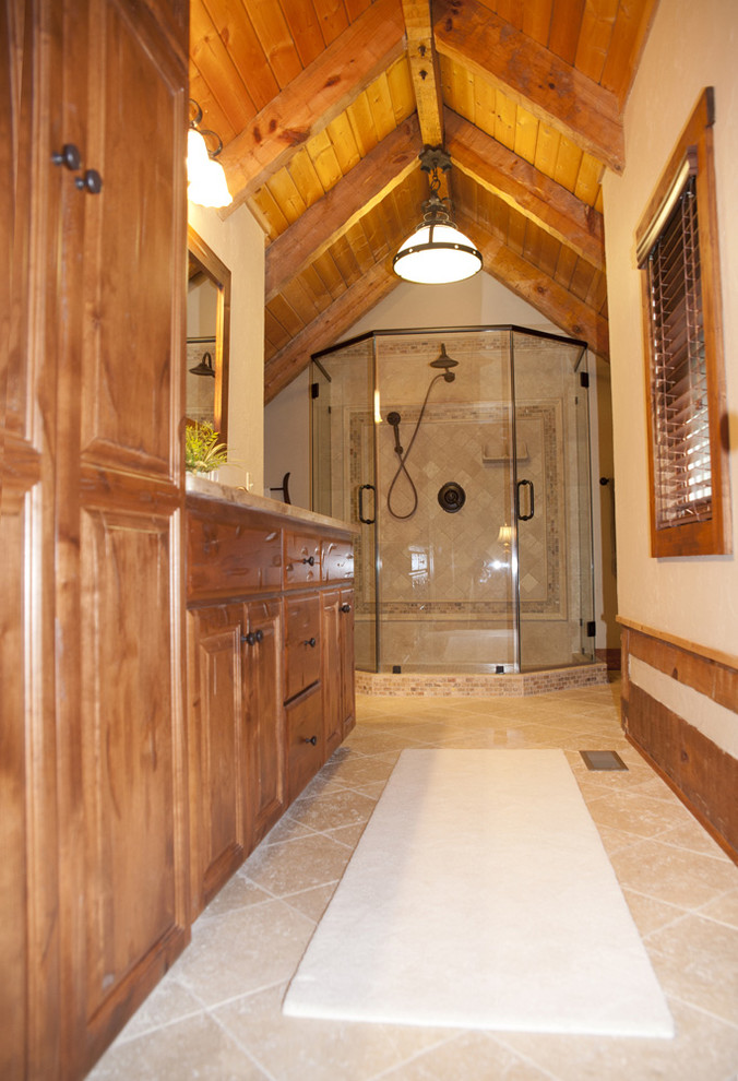 Example of a mid-sized farmhouse brown tile and ceramic tile ceramic tile bathroom design in Charlotte with an undermount sink, recessed-panel cabinets, medium tone wood cabinets, granite countertops, a one-piece toilet and beige walls